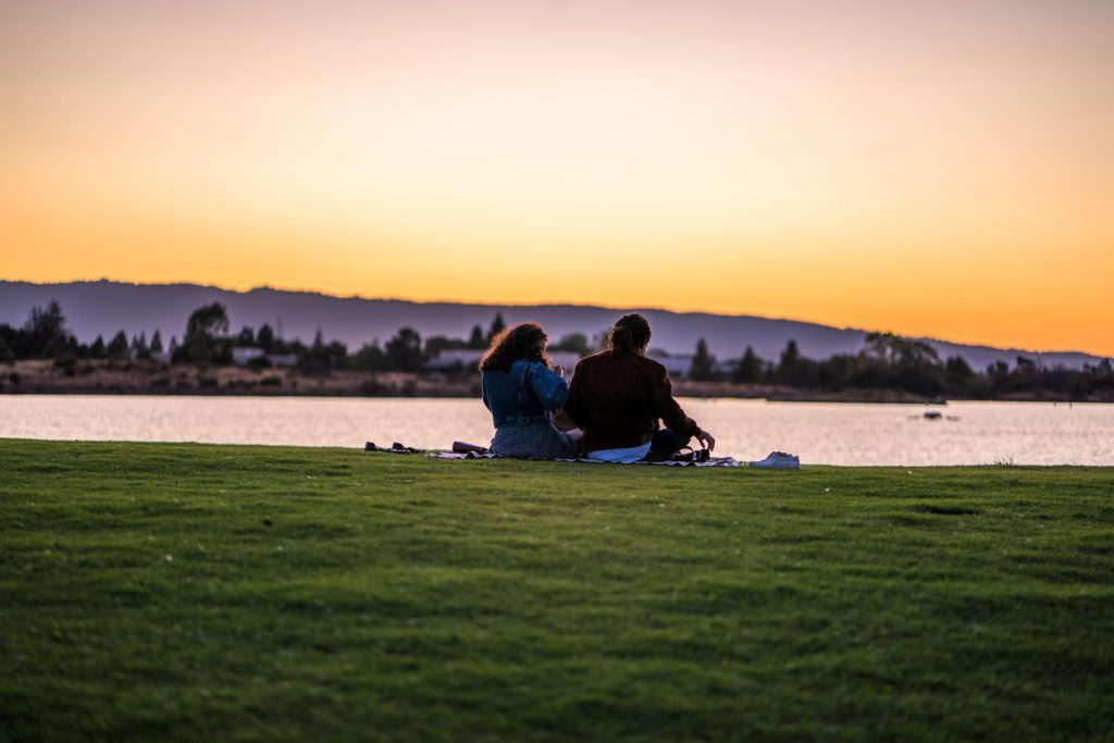 a couple by a lake